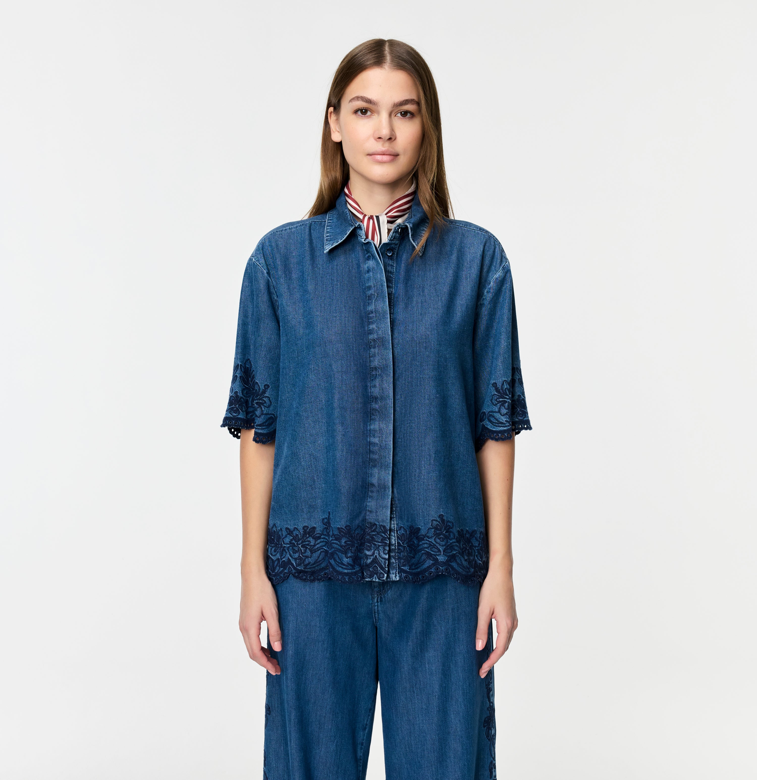 Light denim shirt with embroideries. | SHIRT embro | mid blue heritage wash | Front view of model
