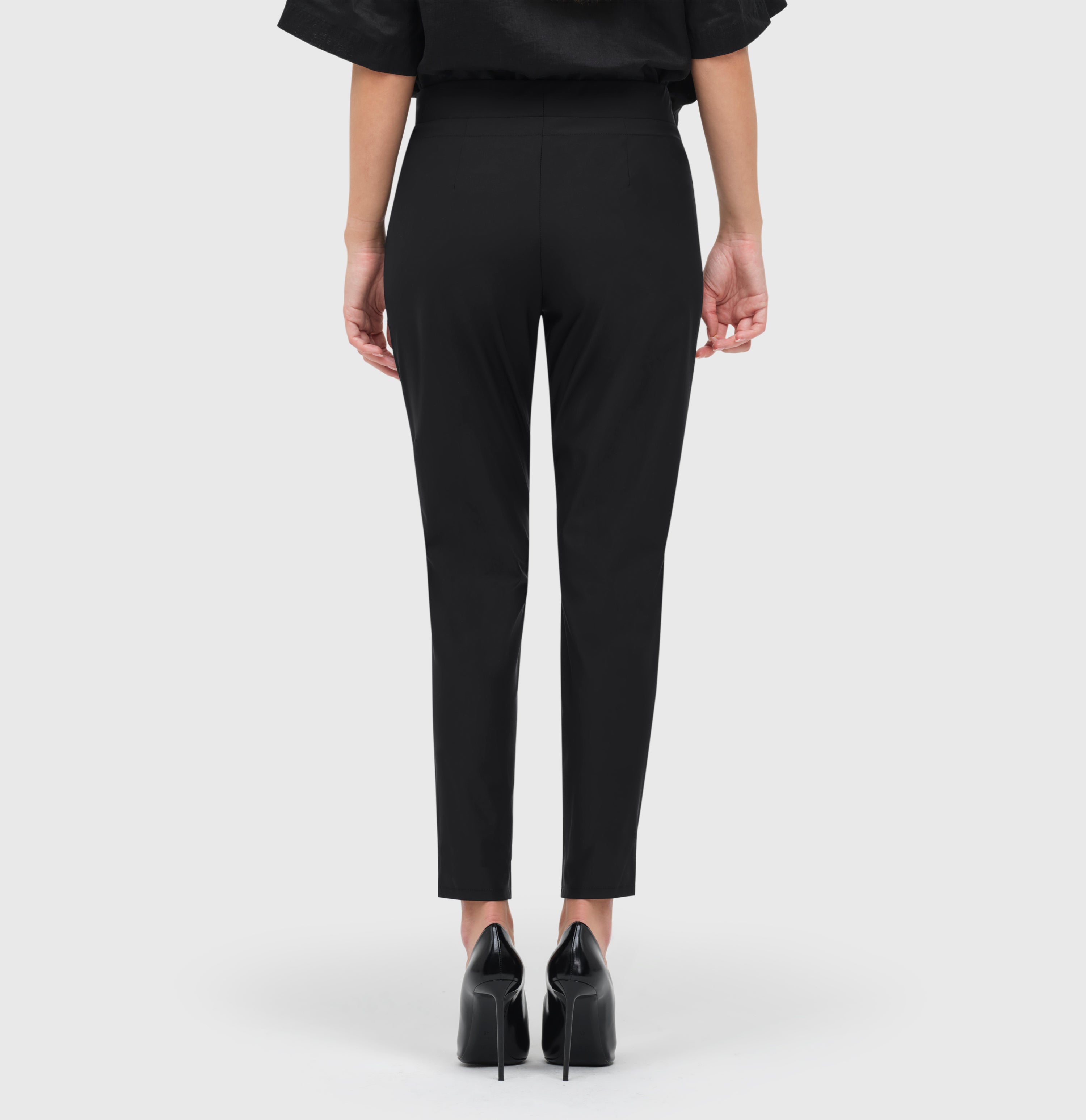 Relaxed slim fit, jogging style trousers. | EASY active | black | Back view of model