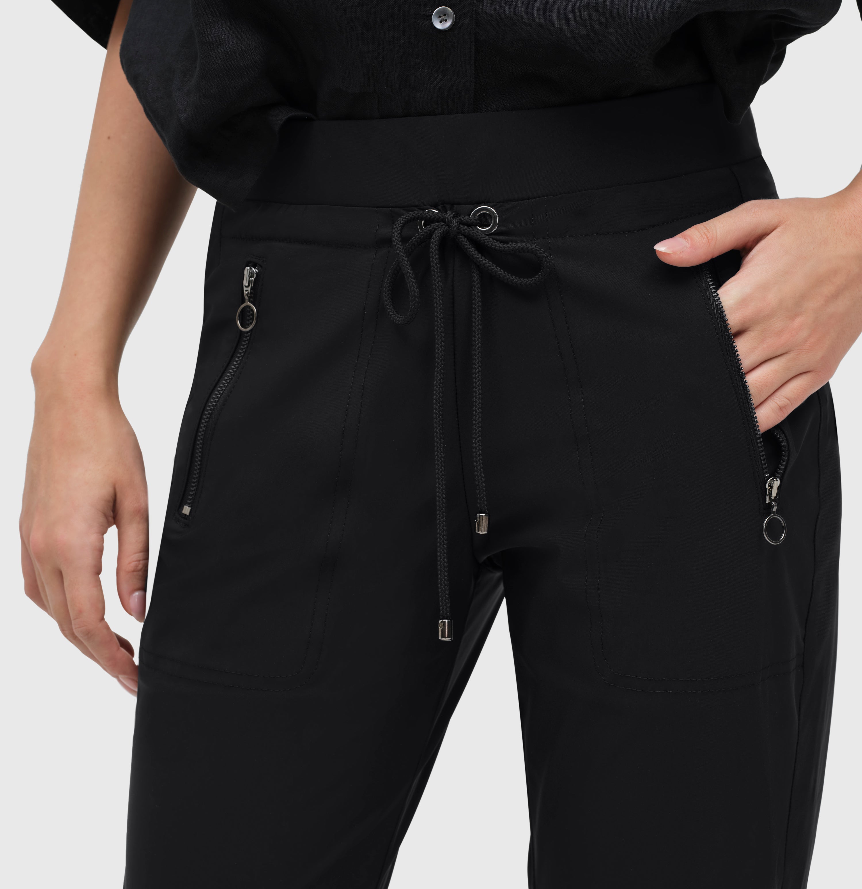 Relaxed slim fit, jogging style trousers. | EASY active | black | Detailed view 2 of model
