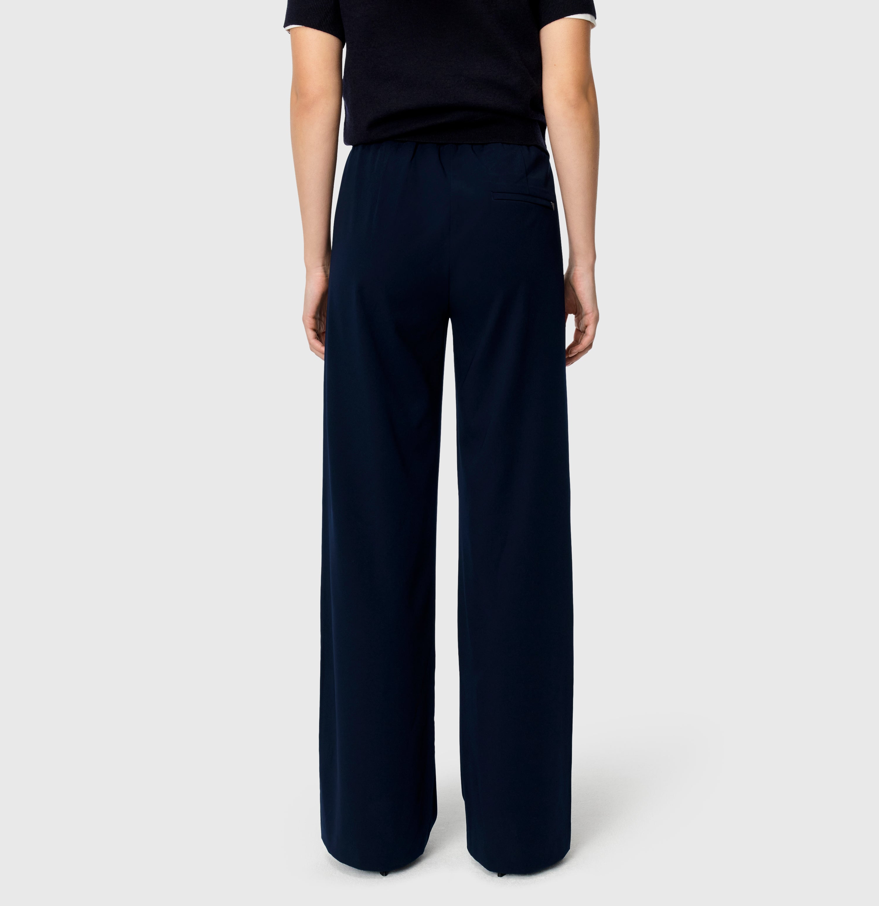 Wide jump-in trousers in a soft crepe material. | CHRISTY | dark blue | Back view of model