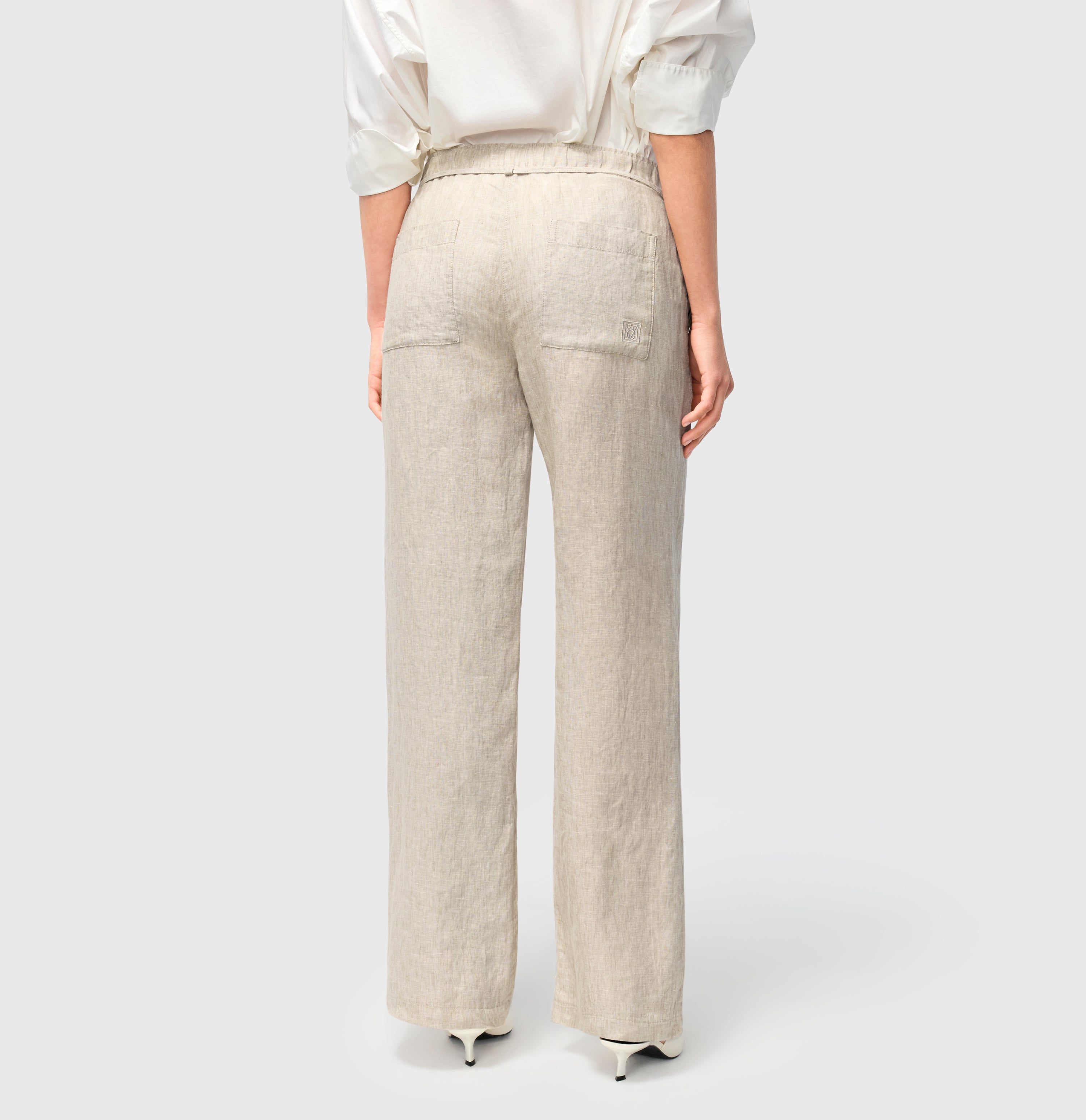 Wide trousers made of pure linen. | CHIARA BELT | almond beige melange | Back view of model