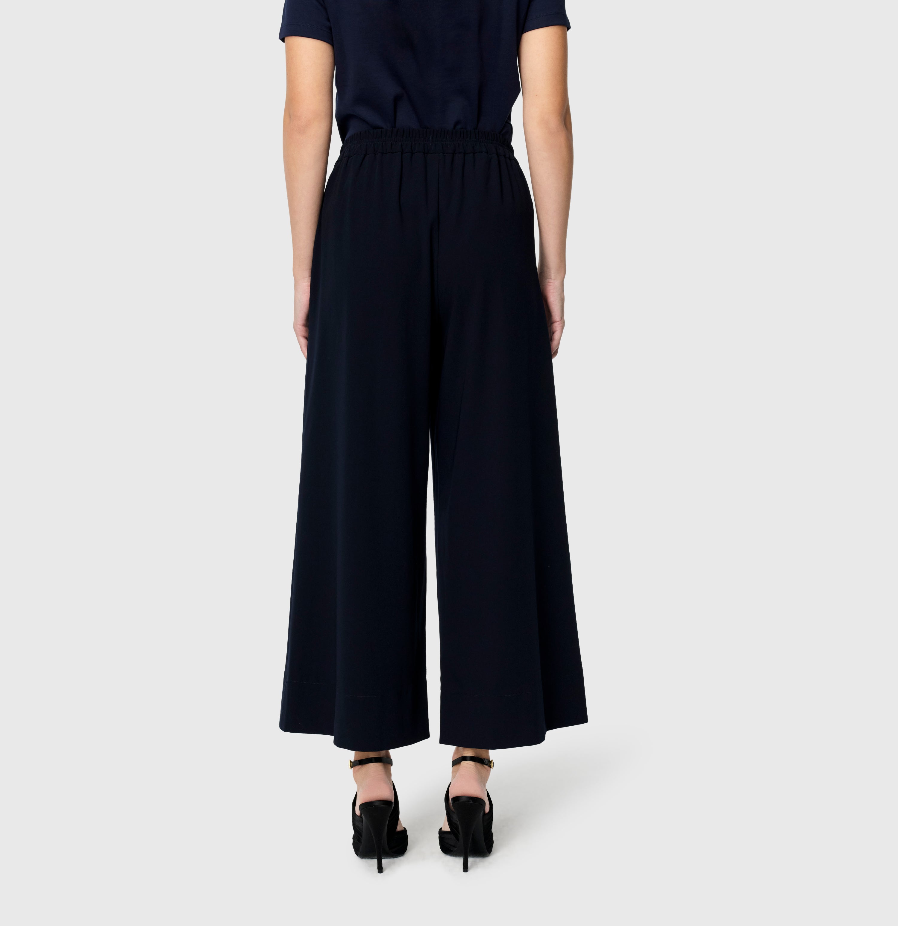 Culotte made of light floating crepe. | CORALIE cropped | dark blue | Back view of model