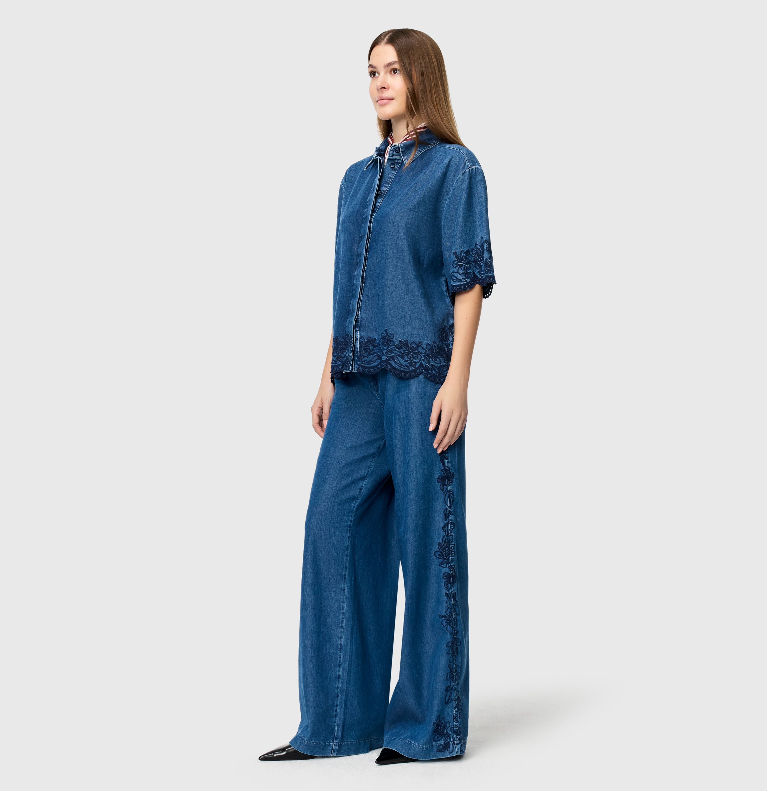 Light, wide jeans with floral embroideries. | WENDY embro | mid blue heritage wash | Full-body of model