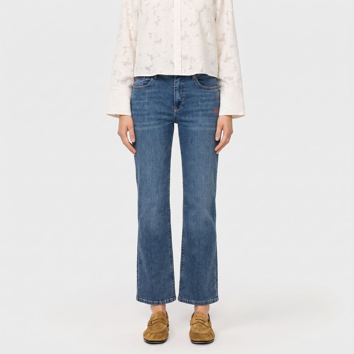 Flared jeans with modern details. | LAURA PEACE | authentic tinted wash | Front view of model