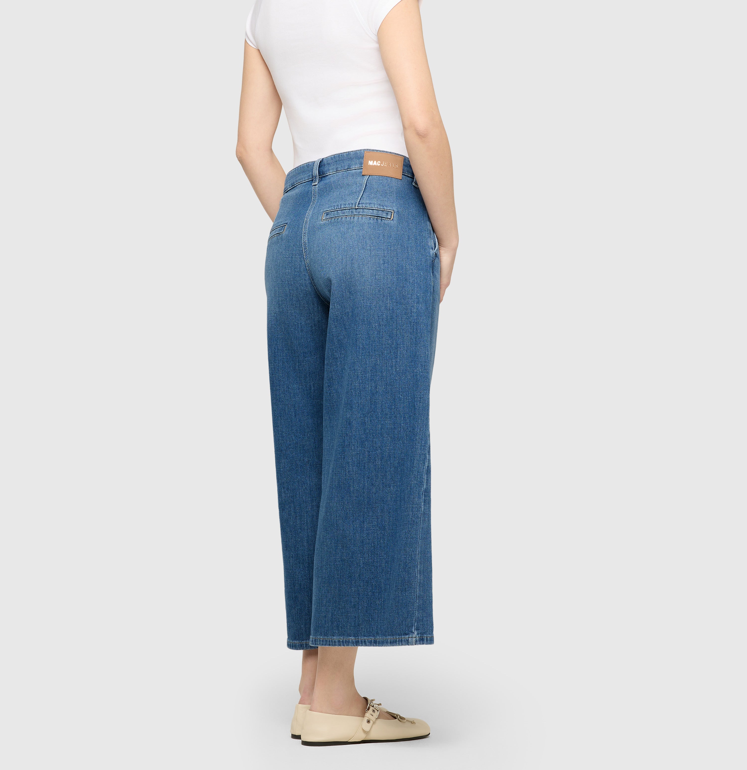 Denim culotte with sporty seam details. | JUNA | basic aqua blue wash | Back view of model