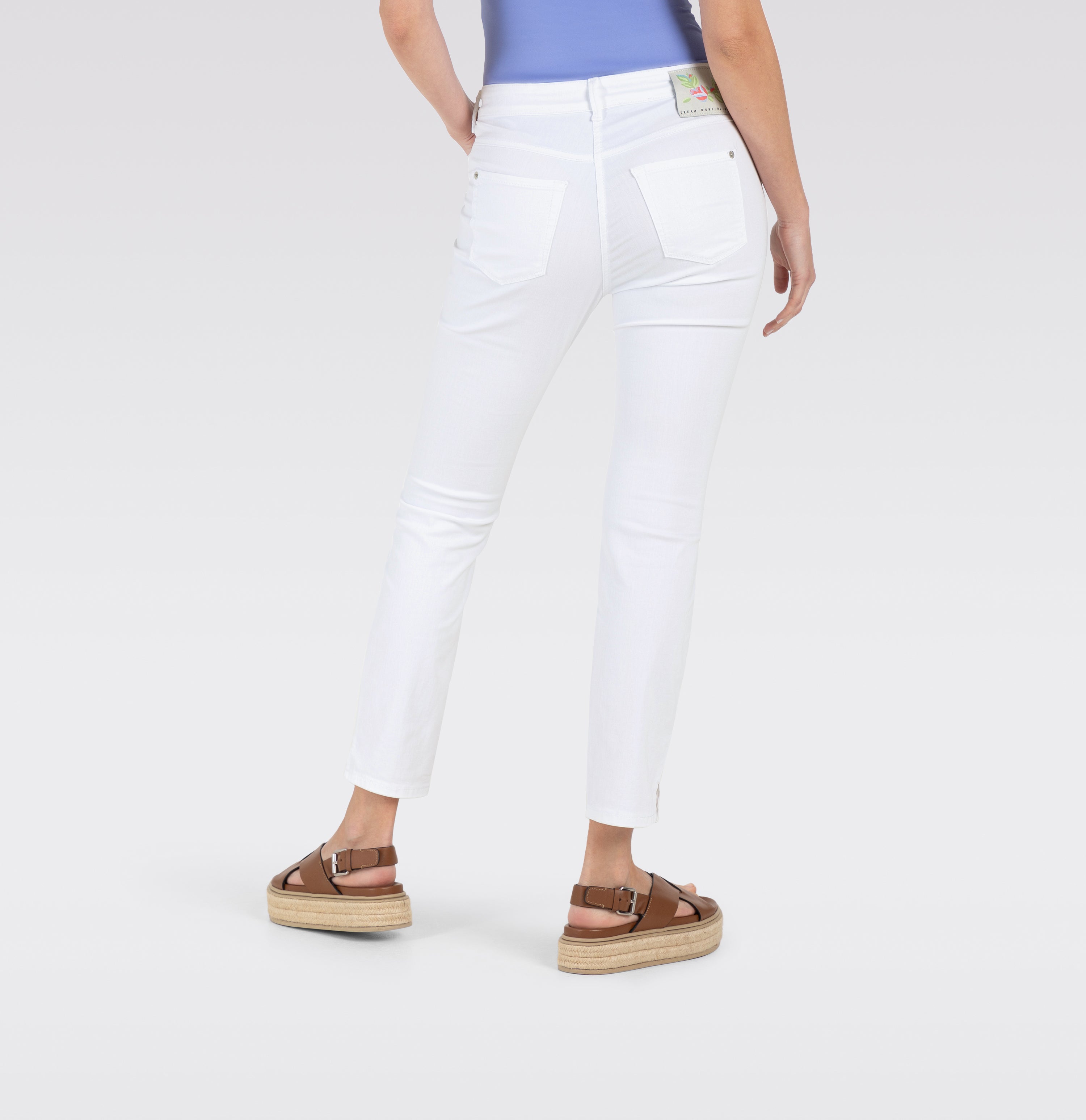 Figure-shaping slim jeans in a light modal blend. | DREAM SUMMER | white denim | Back view of model