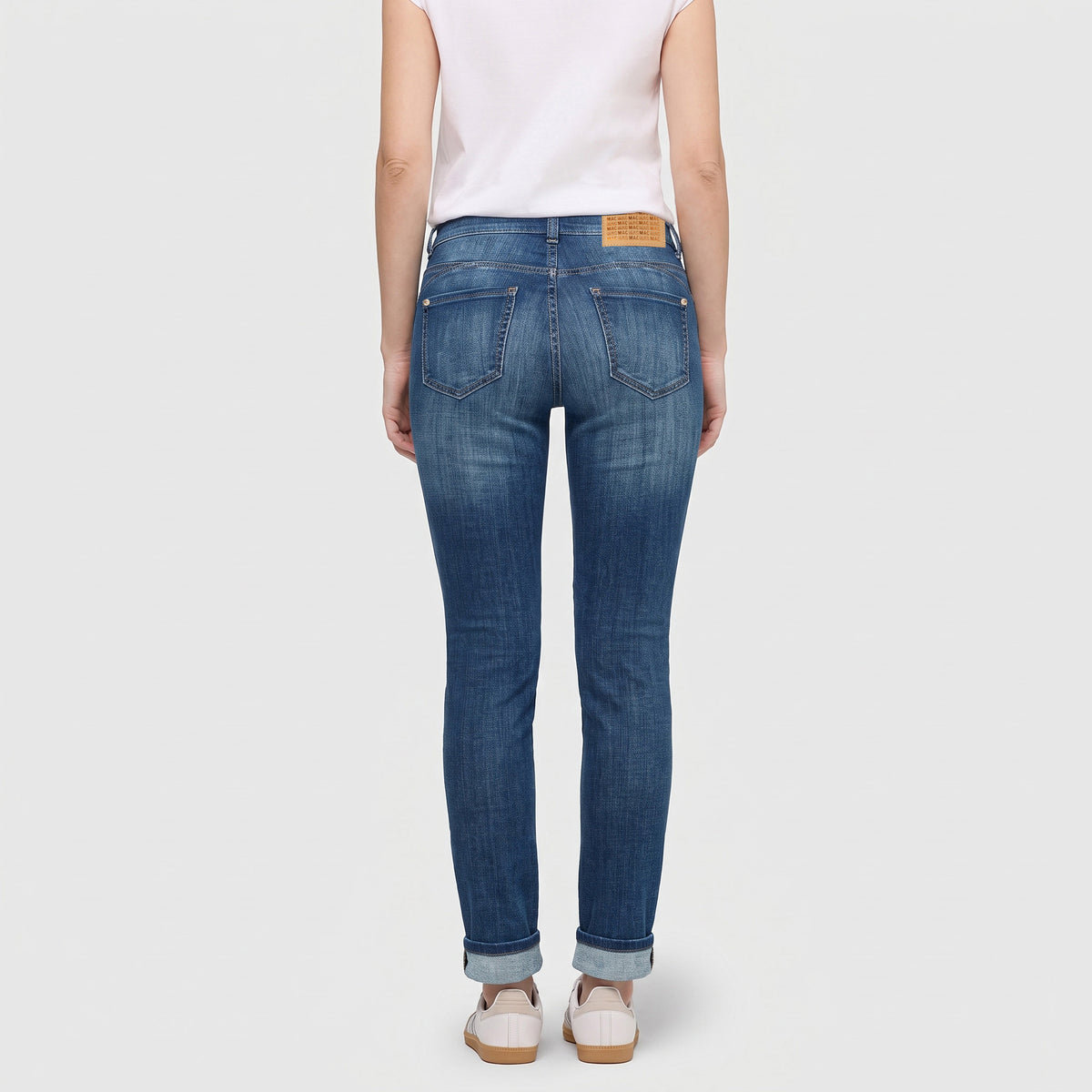 Slim jeans with pocket detail. | SLIM | blue ocean wash | Back view of model