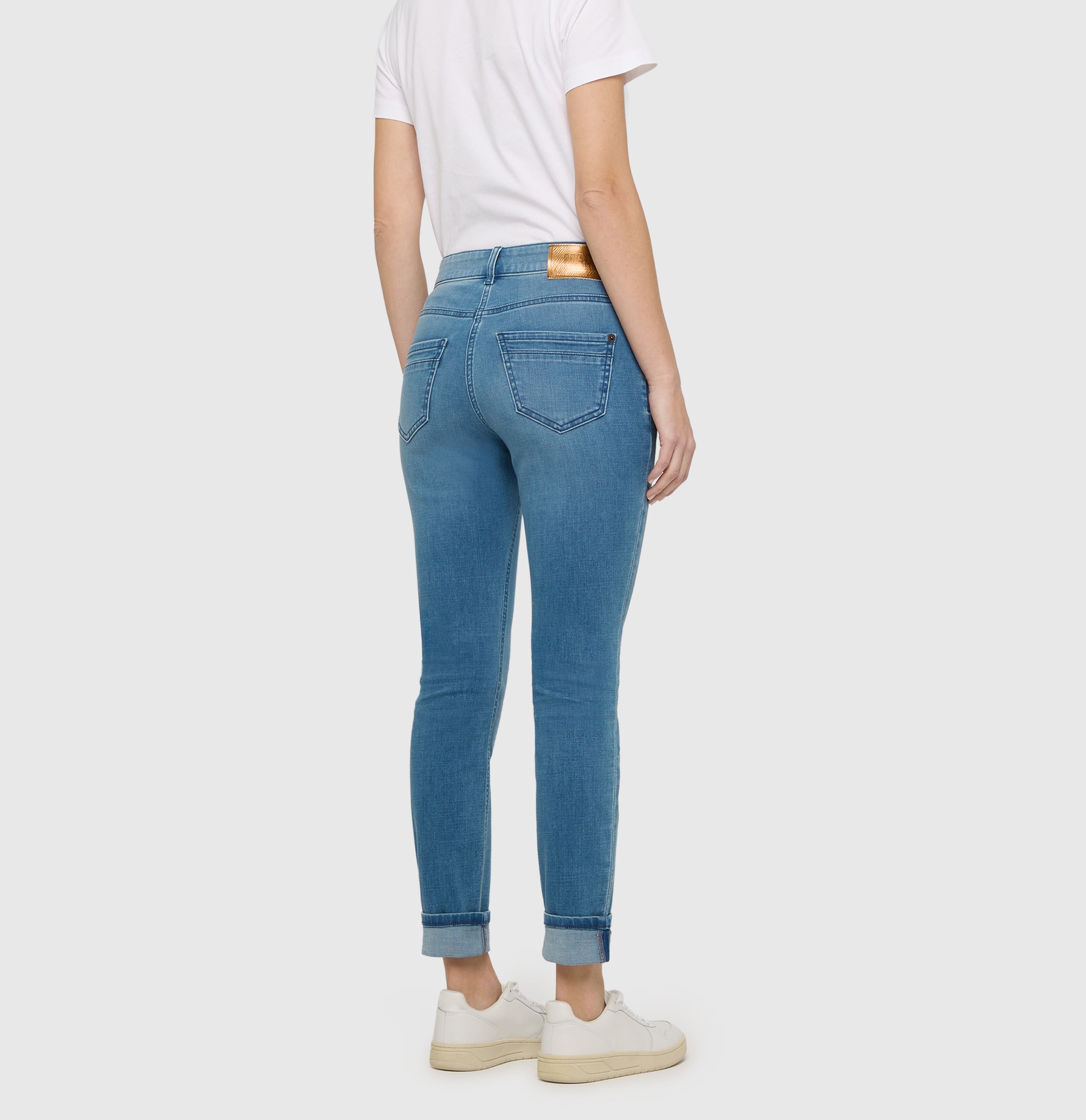 Slim jeans in a light cotton-modal blend. | RICH SLIM | authentic cobalt used | Back view of model