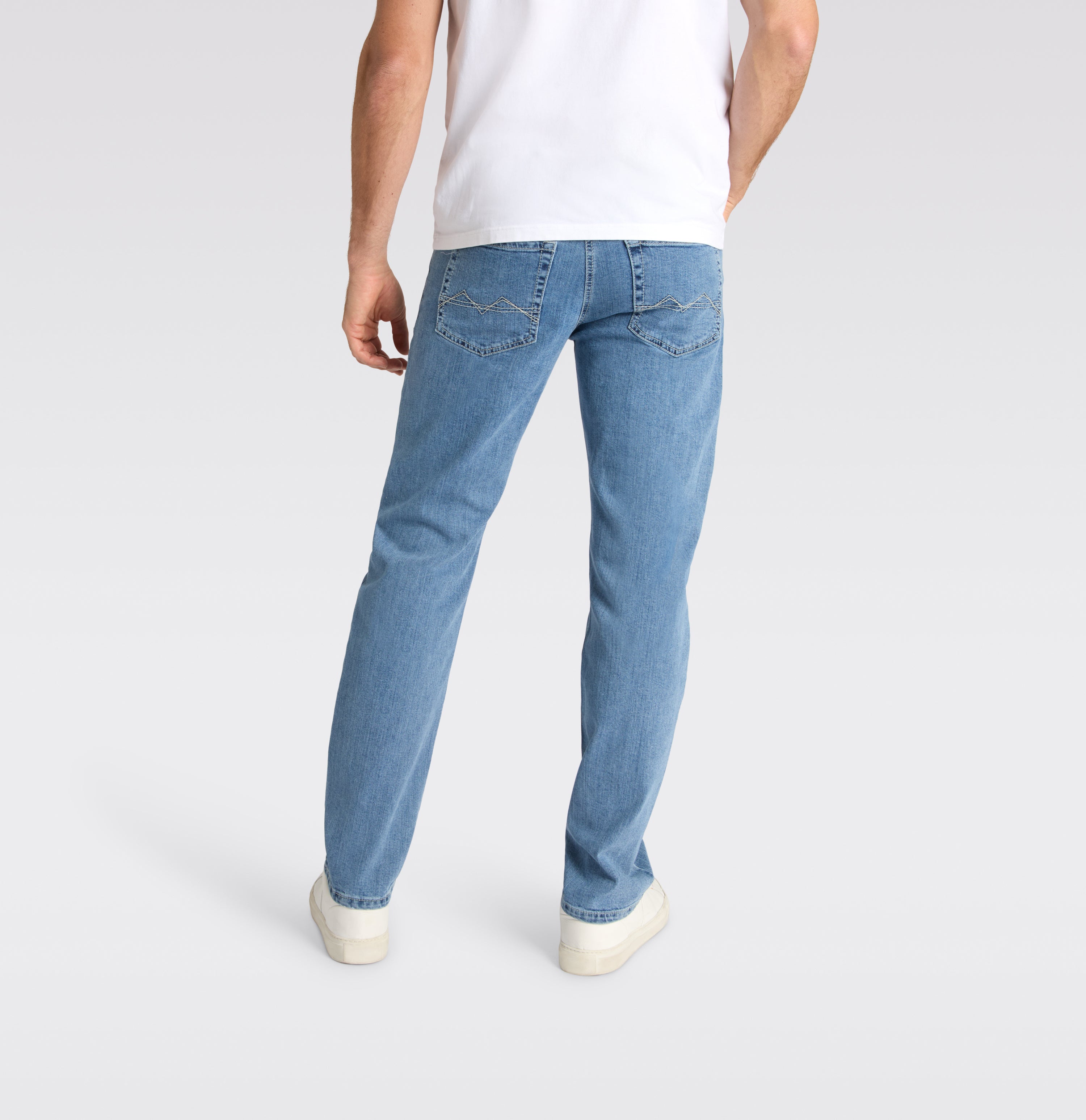 Slim jeans in a sporty wash. | Arne | light indigo bleach | Back view of model