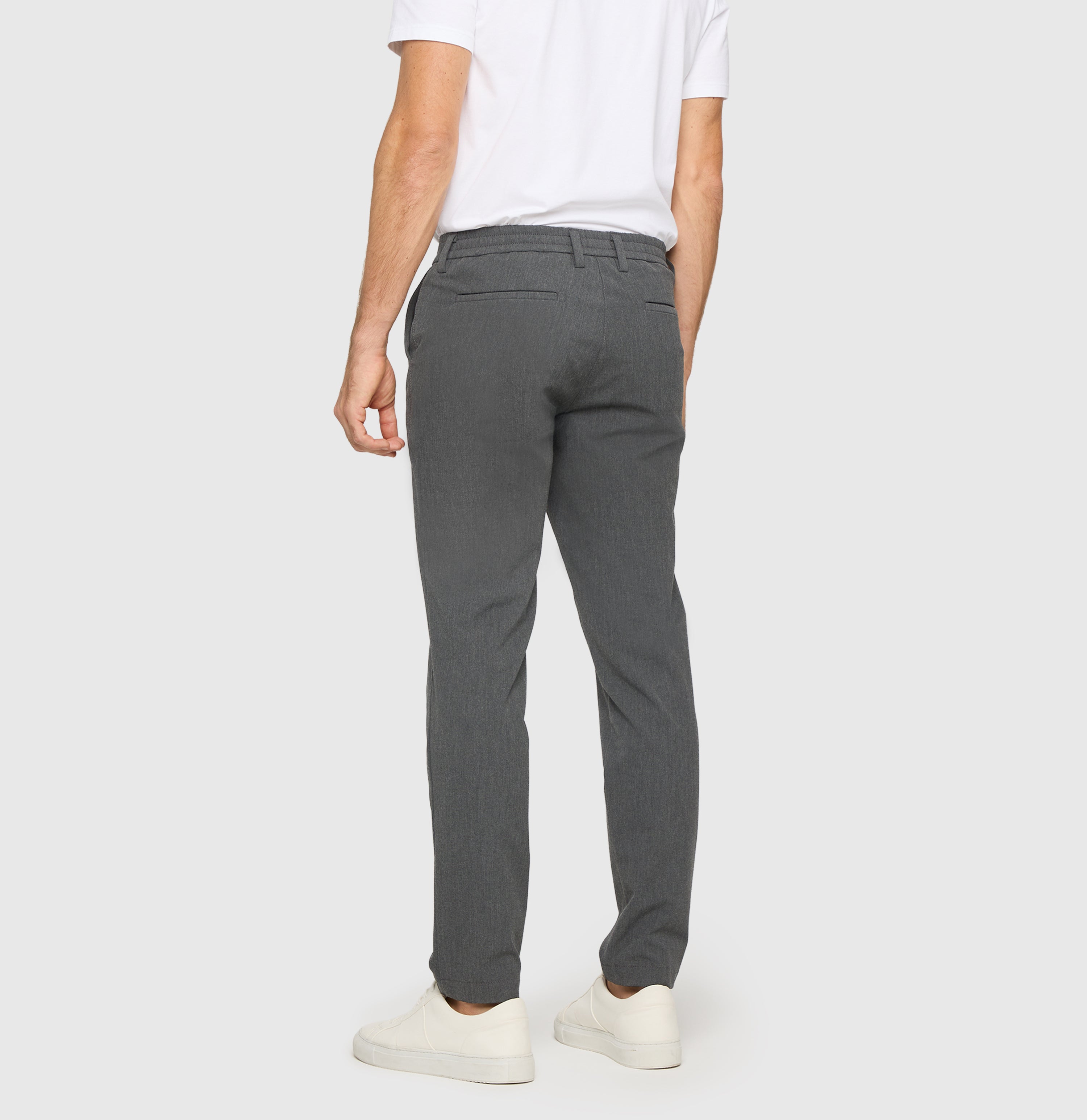 Chino traveller model made of CARBONIUM® gabardine. | Traveller | grey stone | Back view of model