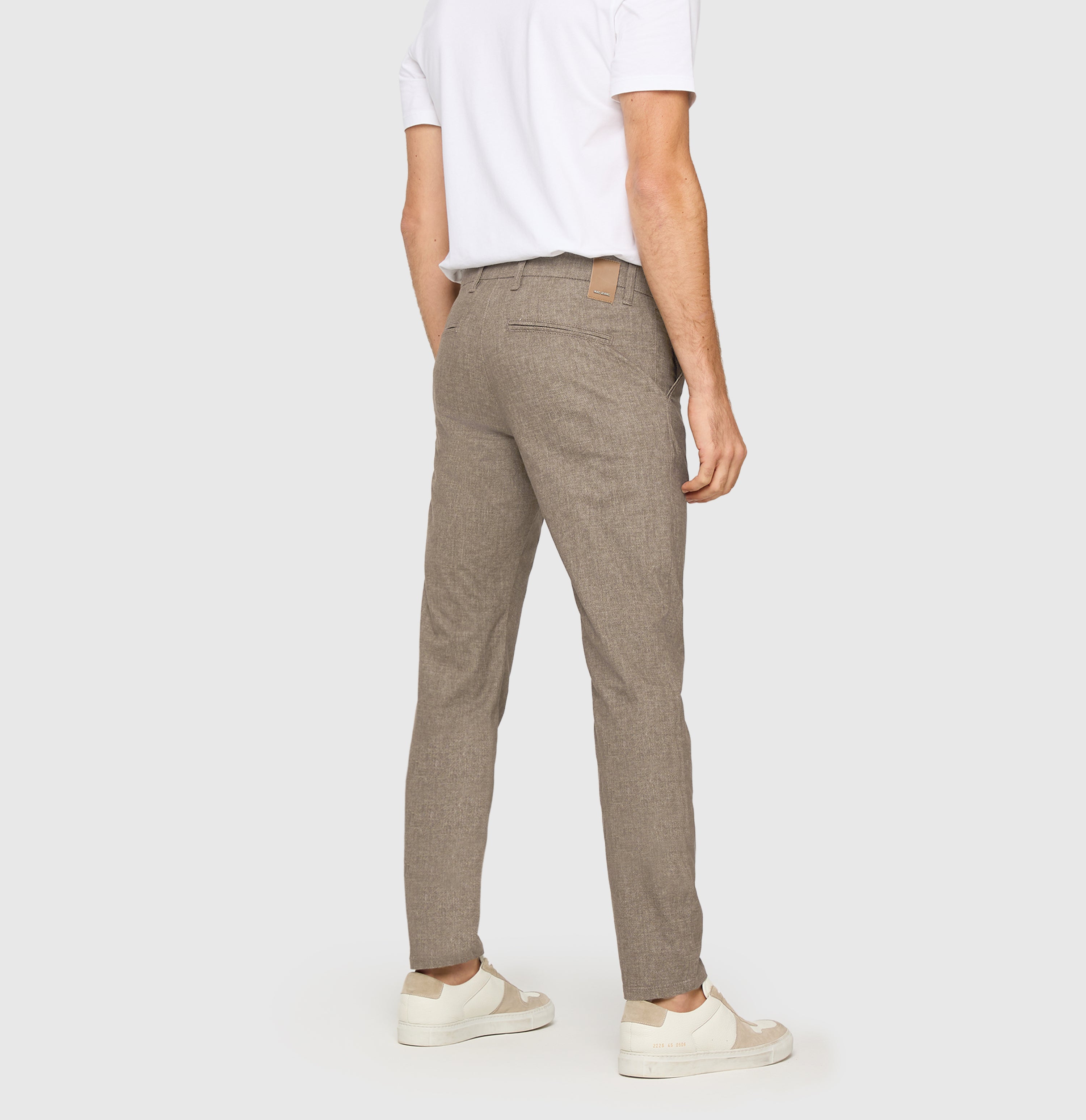 Chino in a finely patterned flannel material. | Lennox | clay printed | Back view of model