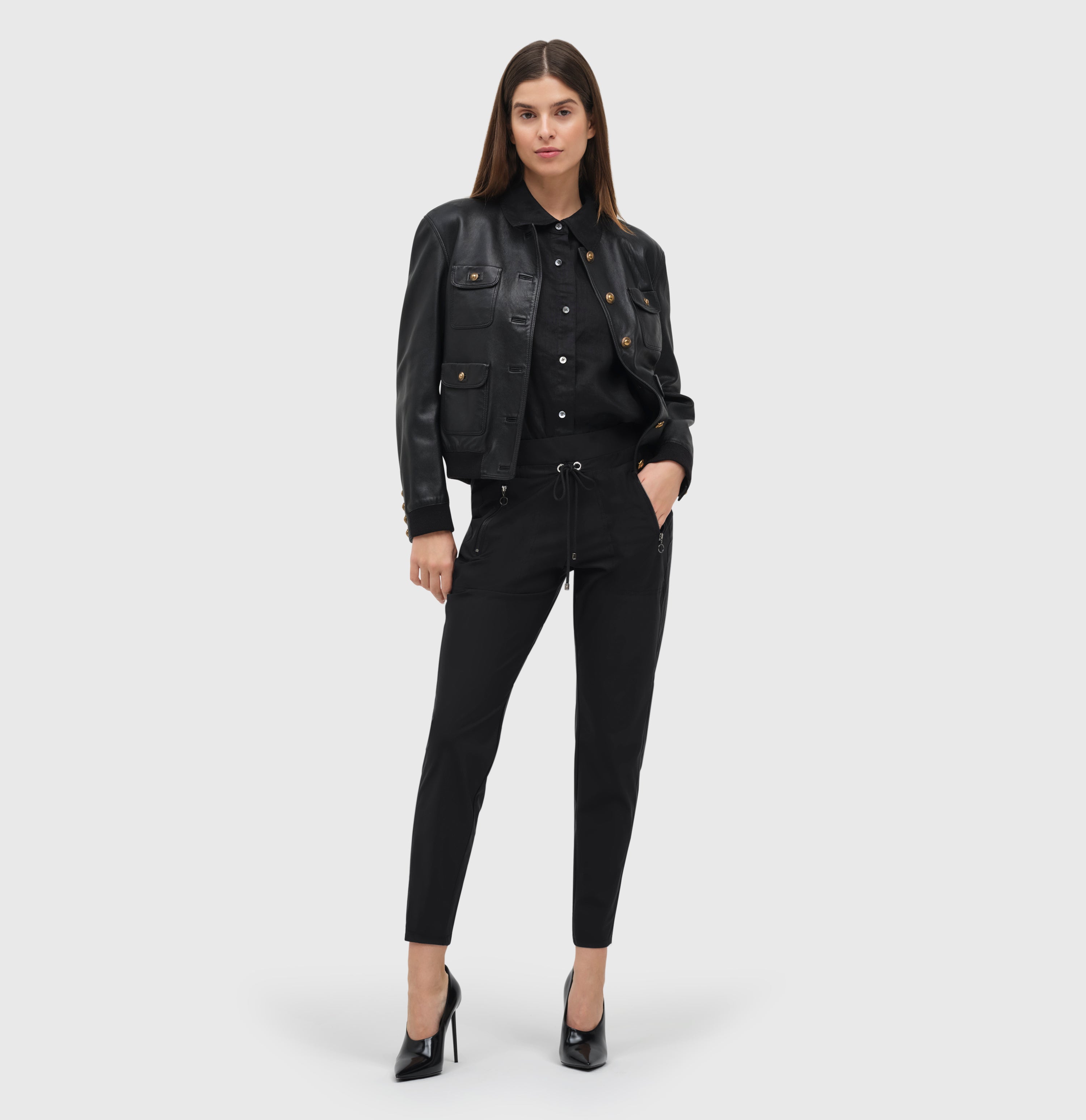 Relaxed slim fit, jogging style trousers. | EASY active | black | Full-body of model