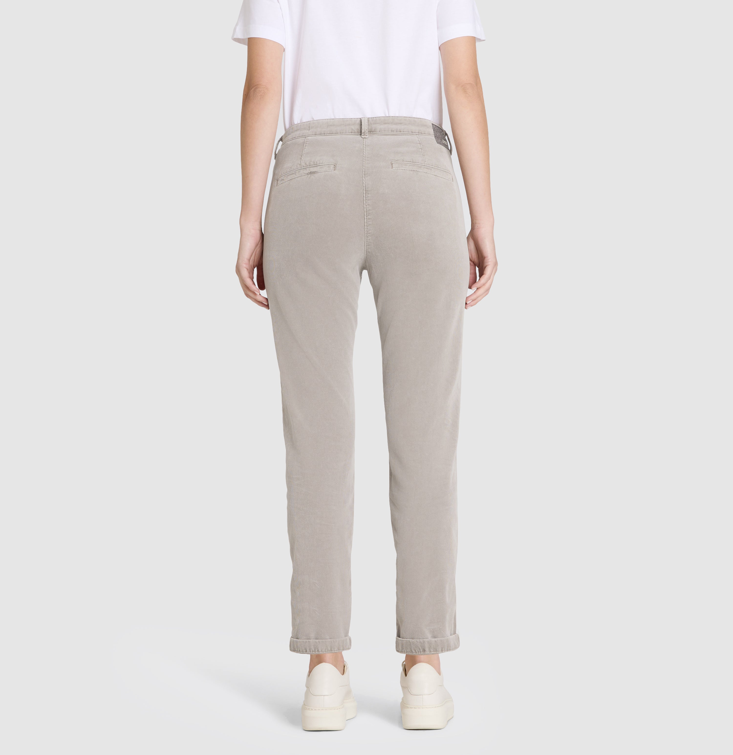 Slim chino made of baby corduroy in brilliant colours. | CHINO turn up | desert taupe | Back view of model