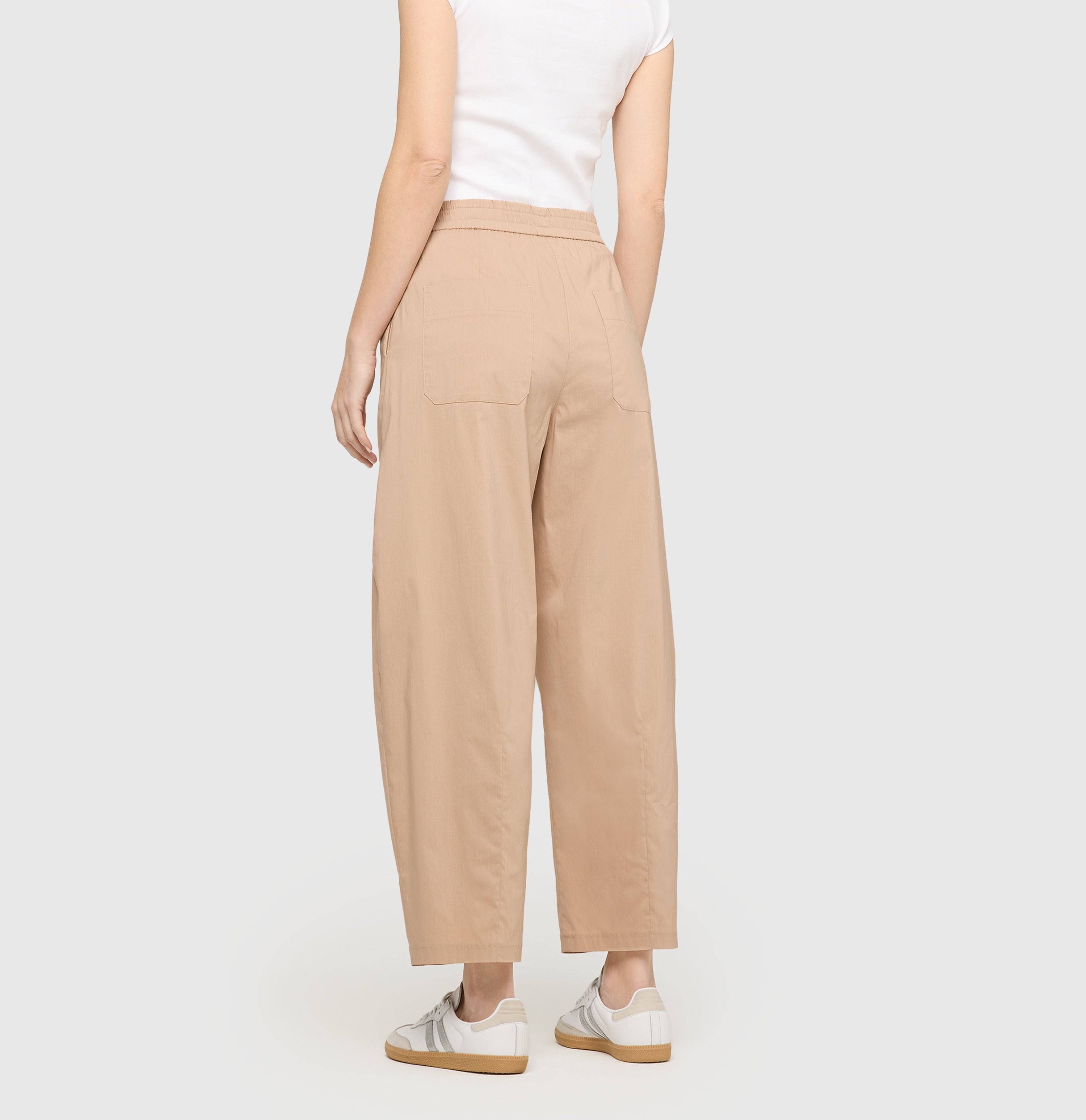 Relaxed trousers in an ultra light material. | THEA | oyster | Back view of model