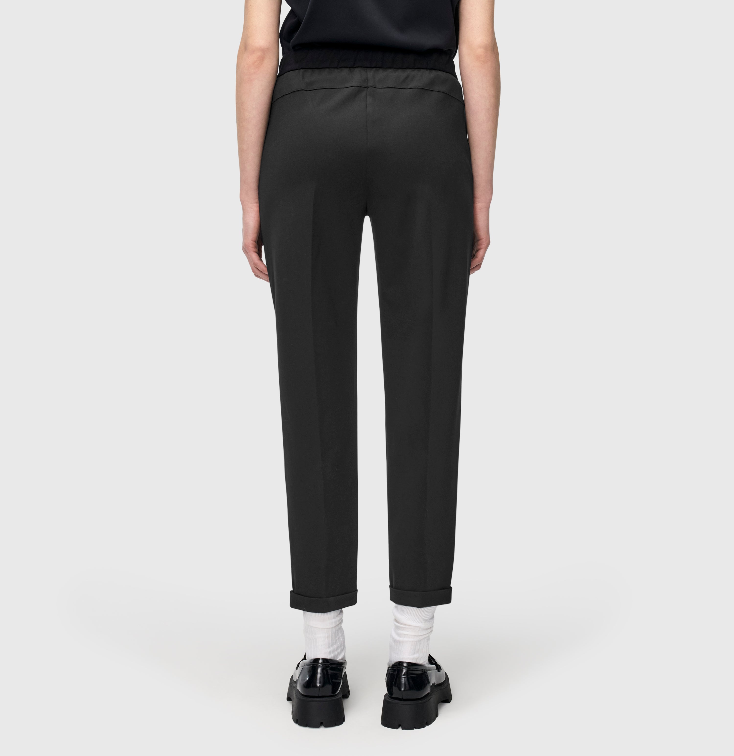 Slim, relaxed trousers made of light jersey. | CAMI | black | Back view of model
