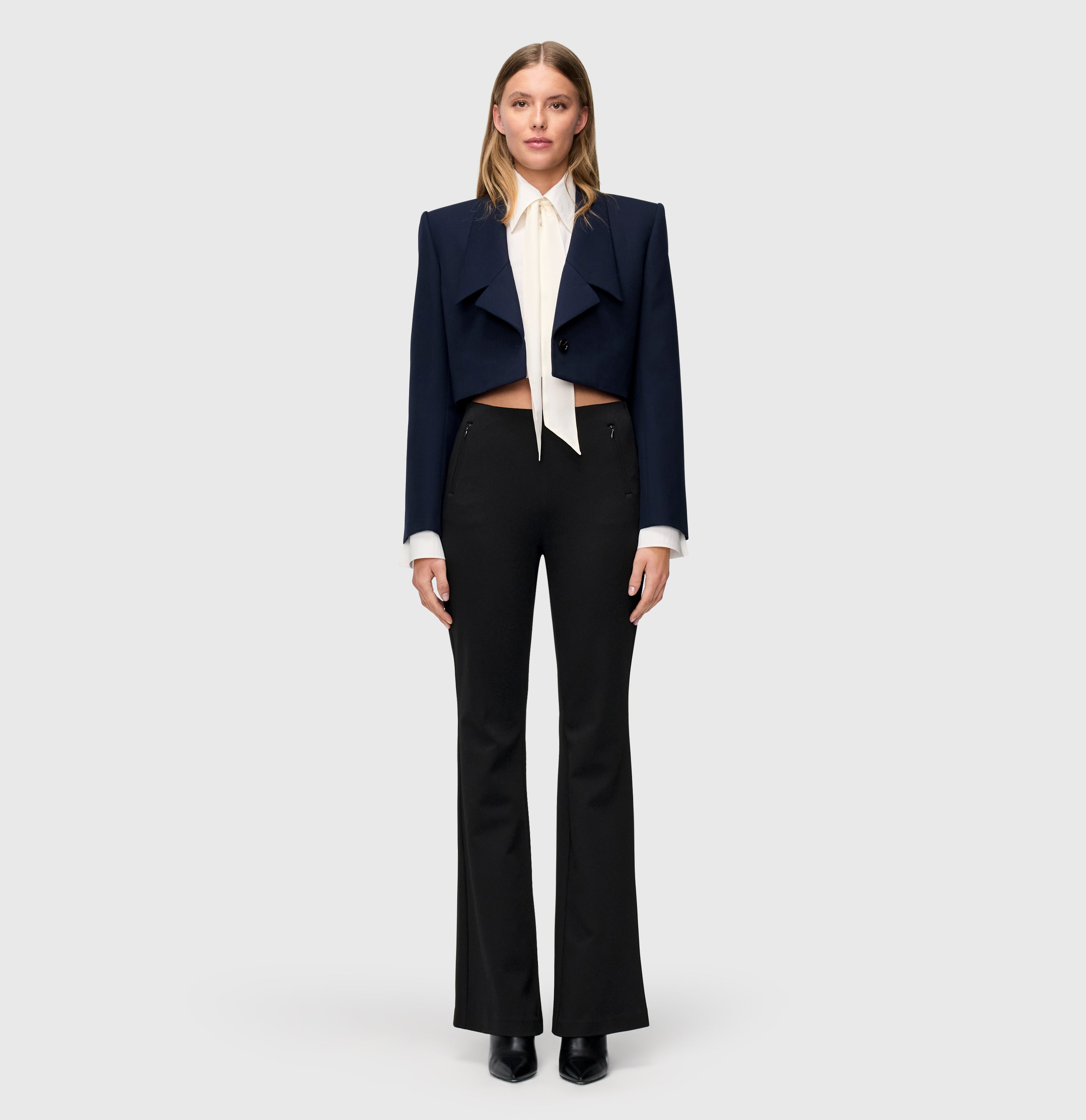 Flared fit in an easy-care bi-stretch material. | S-NAME | S-FBBZ | Full-body of model