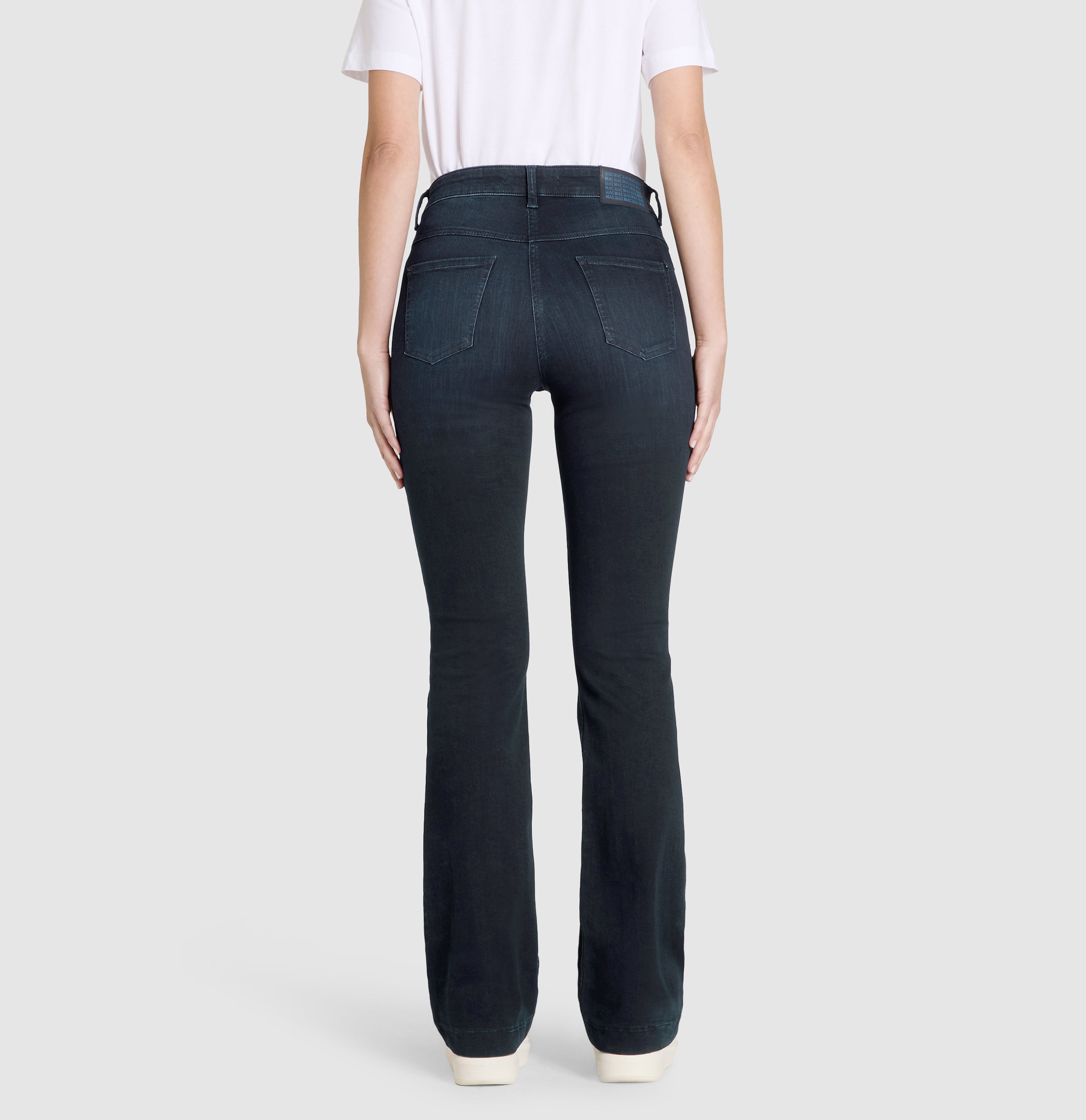 Flexible boot cut jeans with rhinestone details. | S-NAME | S-FBBZ | Back view of model