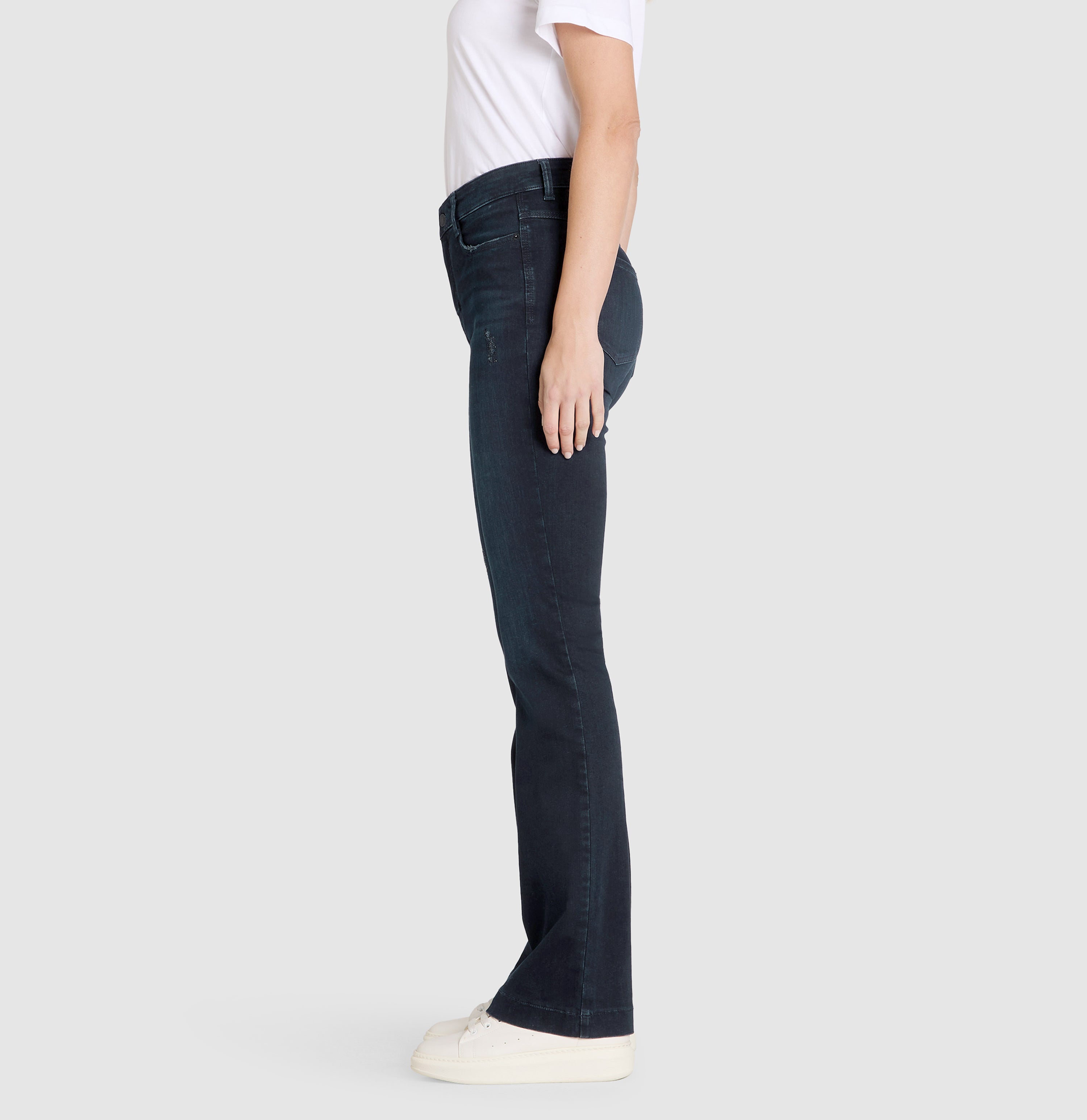Flexible boot cut jeans with rhinestone details. | S-NAME | S-FBBZ | Side view of model