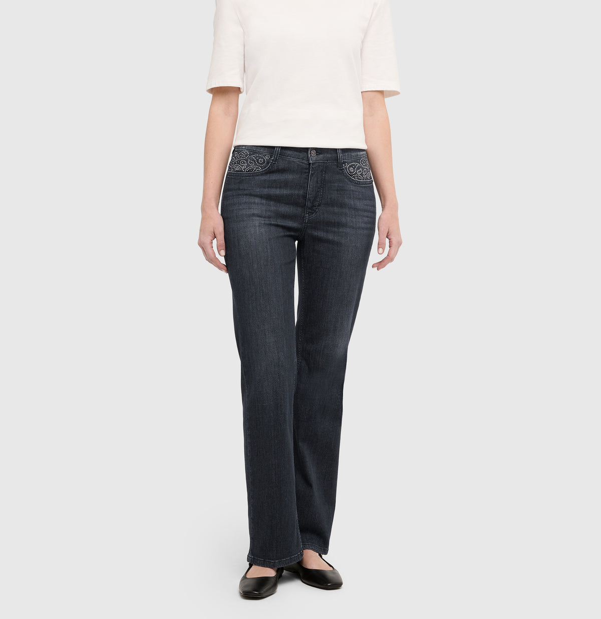 Flared jeans with rhinestone and rivet details. | LAURA paisley glam | commercial black wash | Front view of model
