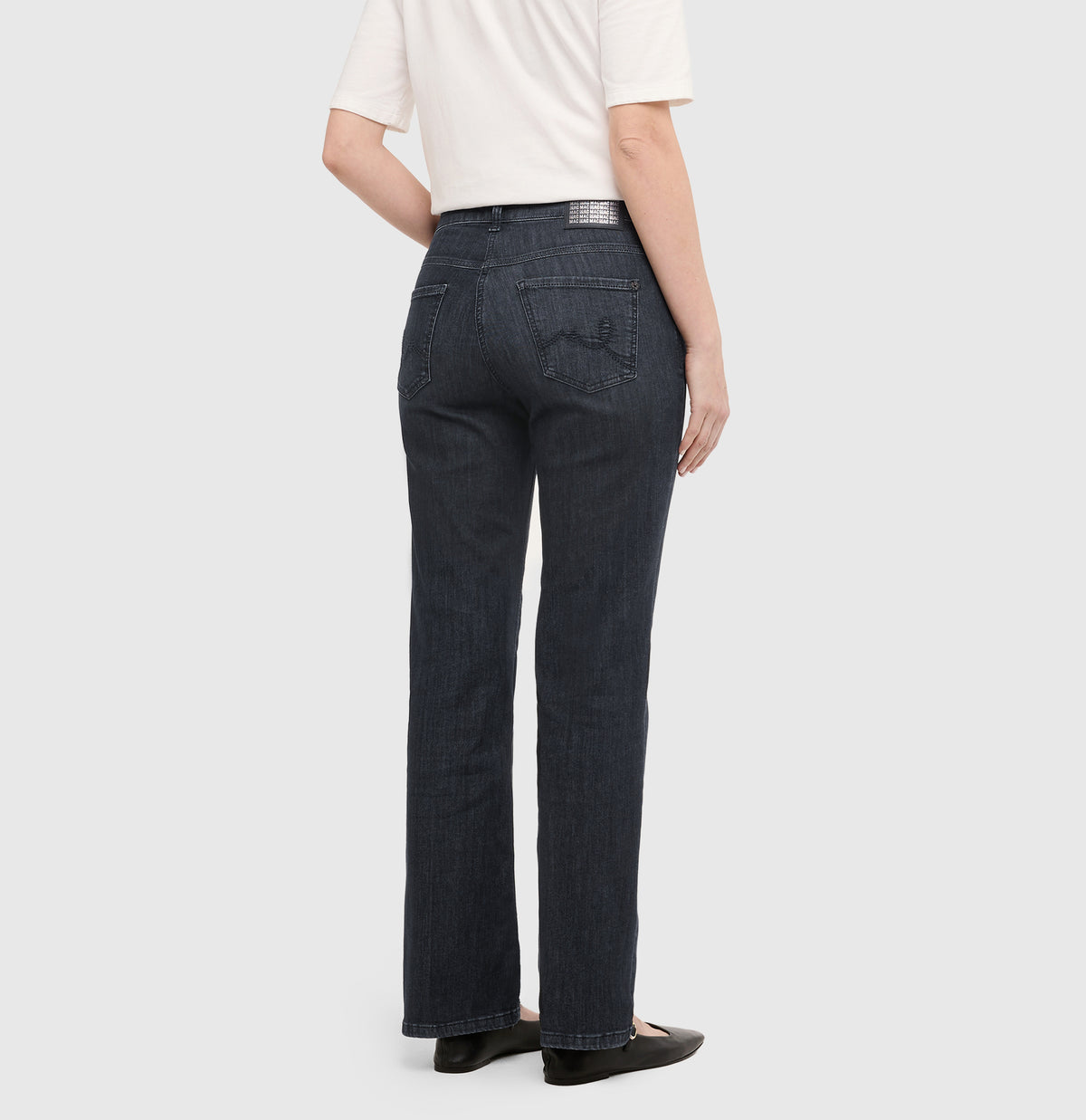 Flared jeans with rhinestone and rivet details. | LAURA paisley glam | commercial black wash | Back view of model
