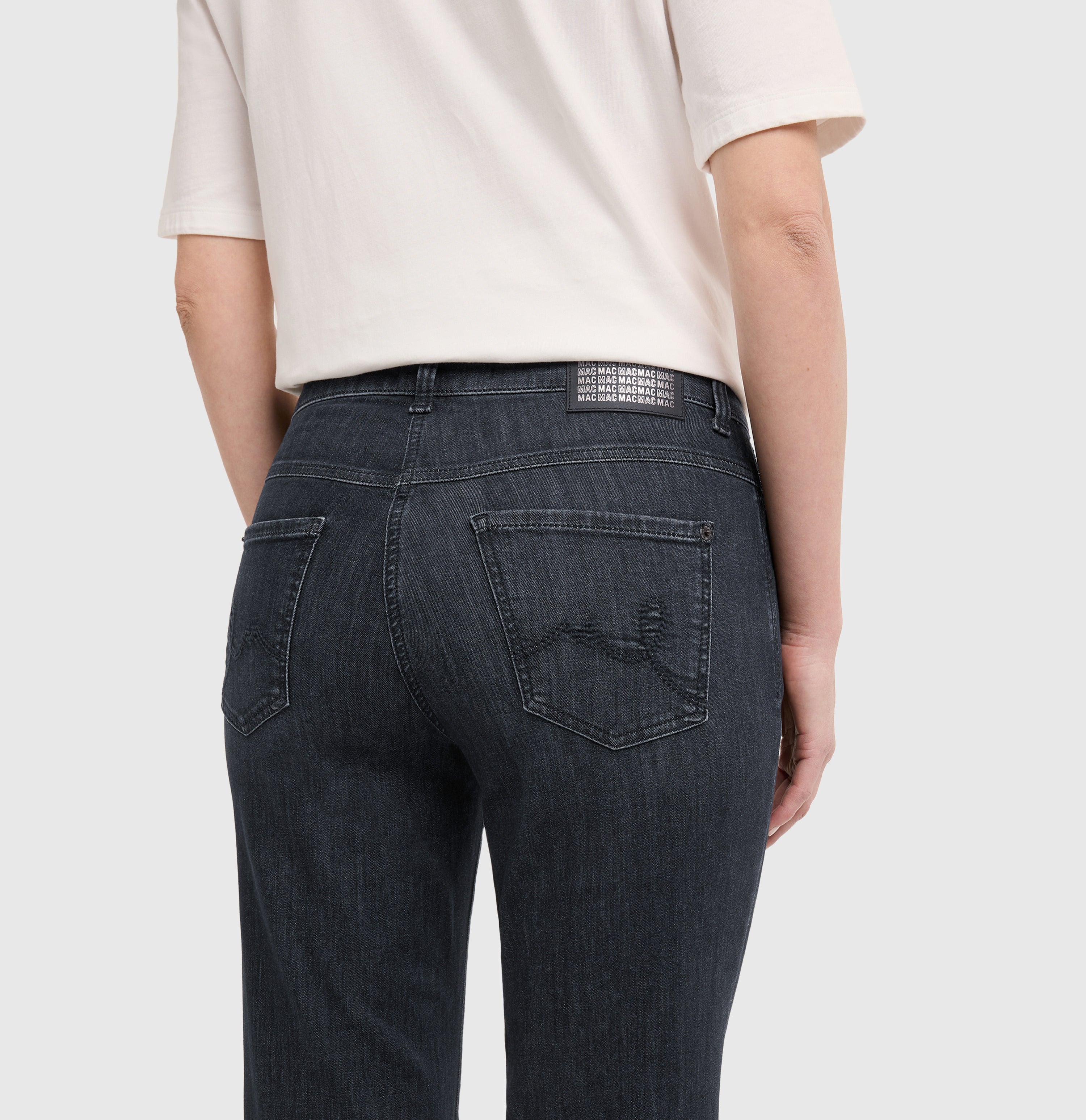 Flared jeans with rhinestone and rivet details. | LAURA paisley glam | commercial black wash | Side view of model