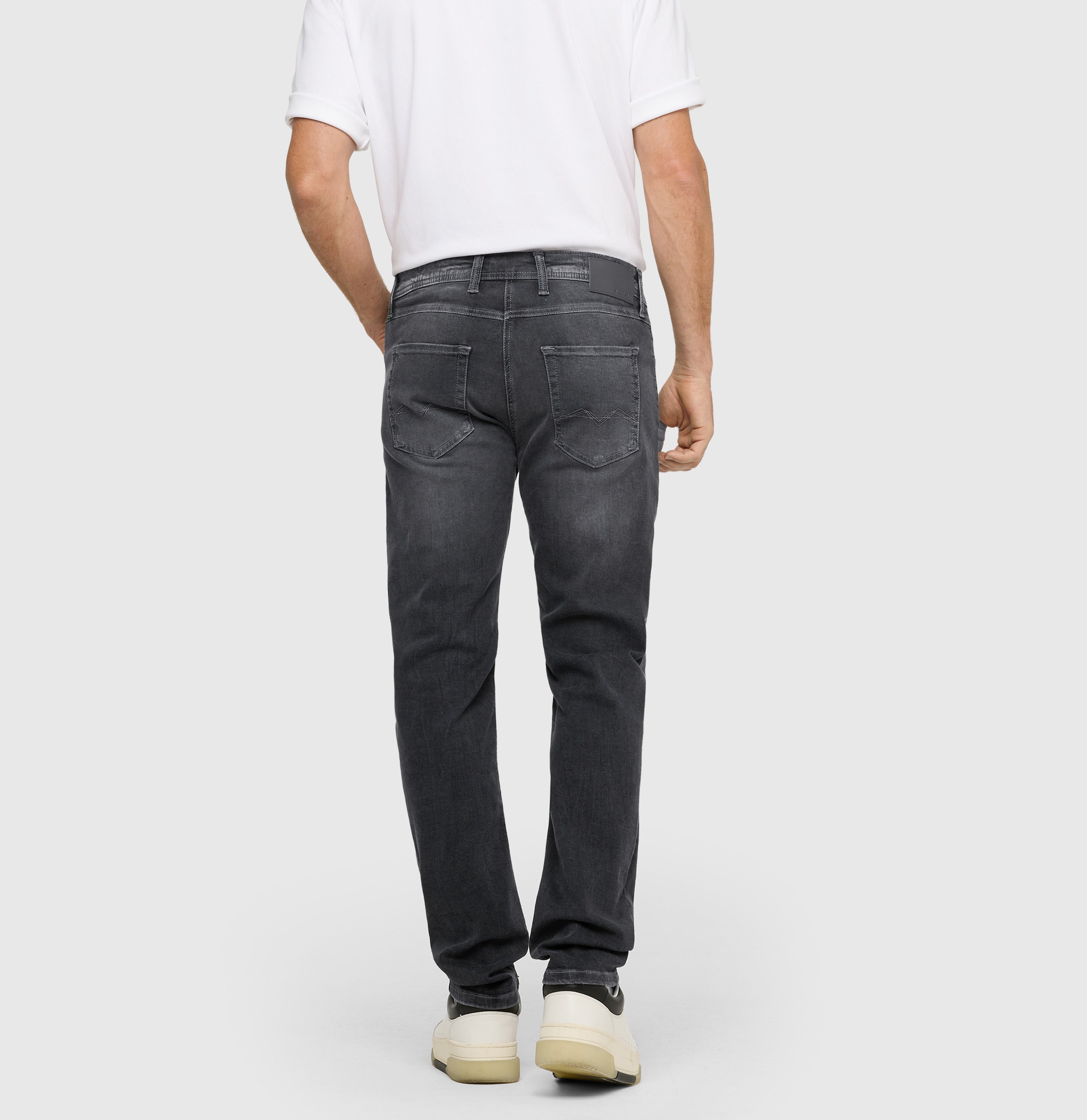 Ultimate driver’s jeans with a slim cut. | Driver Jeans | authentic mid grey used | Back view of model